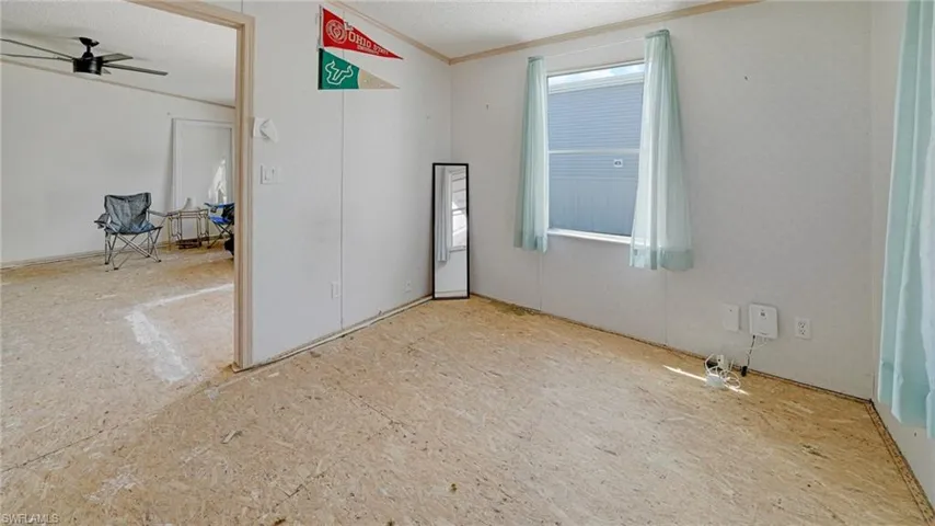 Empty room featuring ceiling fan