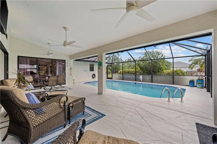 Relax in the Covered Area Under Truss while still Enjoying the Pool.