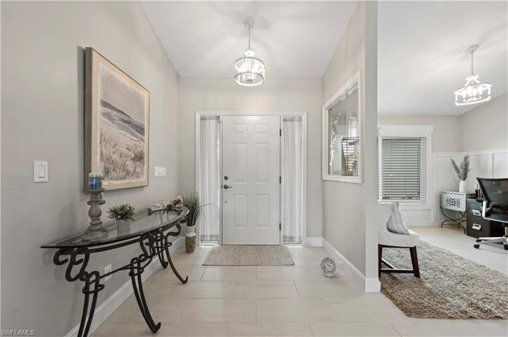 View to Front Door and Den from Dining Area