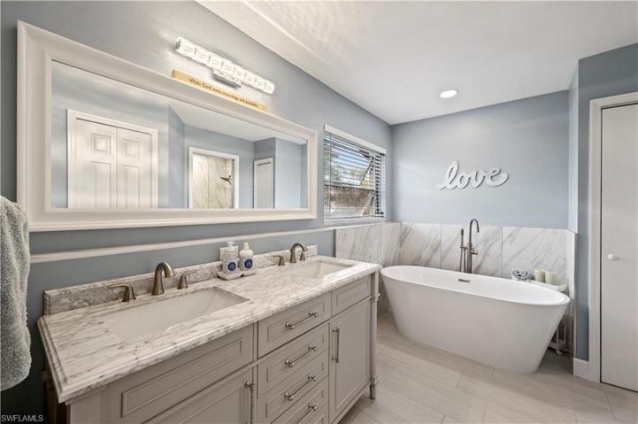 All NEW Fixtures, Dual Sinks, Cabinets, Tile, Lights, SoakTub, Shower Glass, Shower Tile, Toilet
