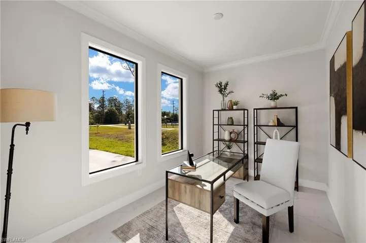Home office with crown molding and light marble finish floors