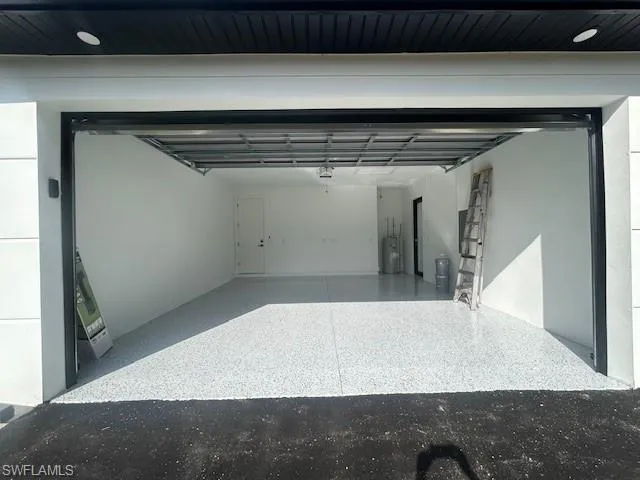 Garage featuring water heater