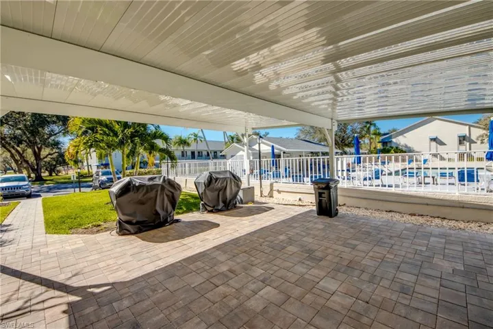View of patio with a residential view and area for grilling
