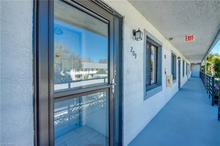 View of exterior entry featuring stucco siding