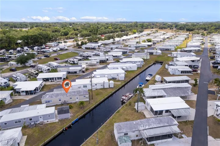 Aerial view with a water view and a residential view