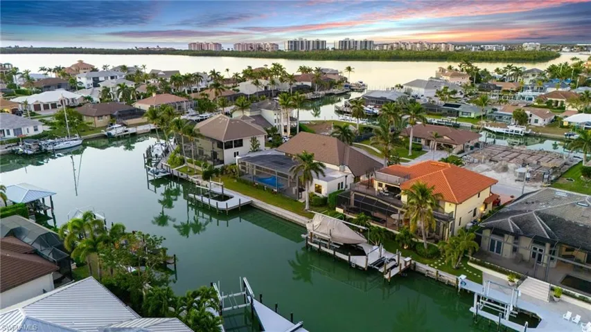 Aerial perspective of suburban area with a large body of water