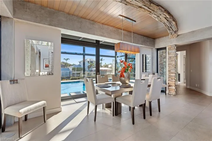 Dining room featuring wood ceiling and baseboards