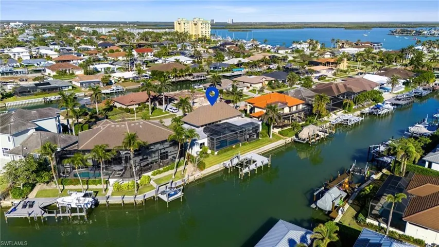 Aerial view of residential area with a large body of water