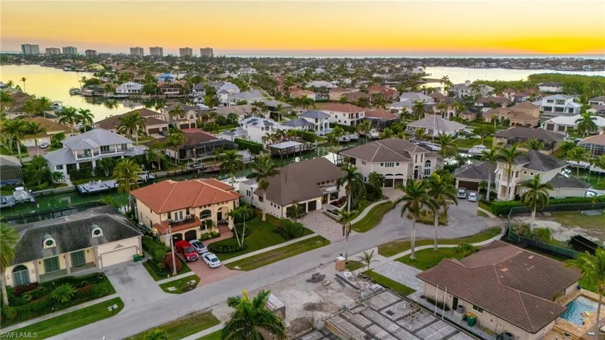 Aerial view of residential area with a large body of water