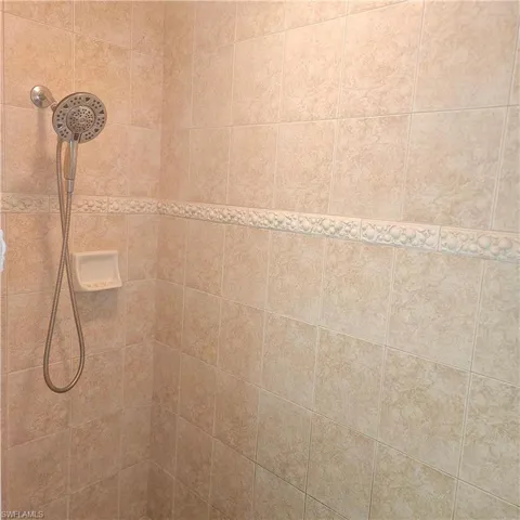 Bathroom view of a tile shower