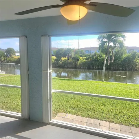 Unfurnished sunroom featuring a water view