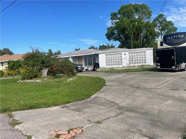 View of front of house with a front yard