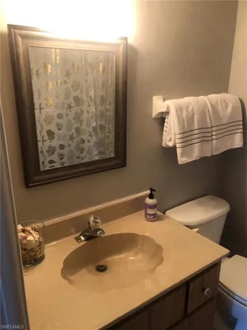 Bathroom with vanity and toilet