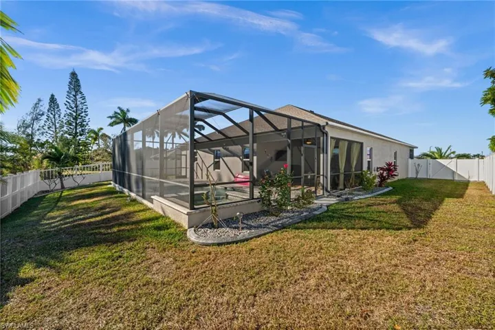 Screened pool area and fenced yard for privacy