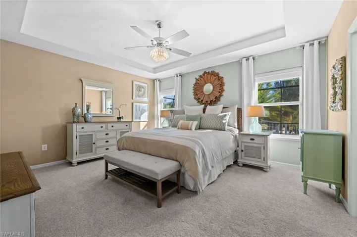 Primary bedroom with tray ceiling