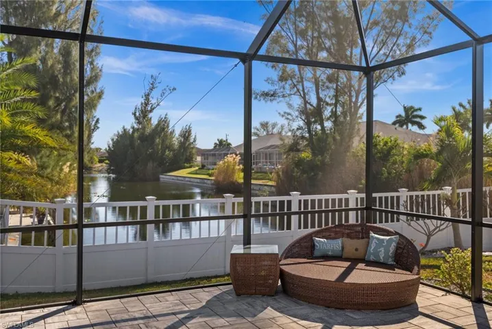 Screened lanai with canal backdrop