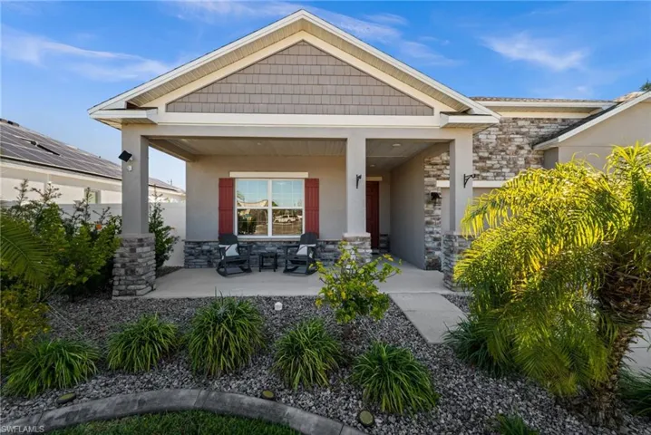 Fresh landscaping with new curbing and stone accents. Plus this great sitting area!