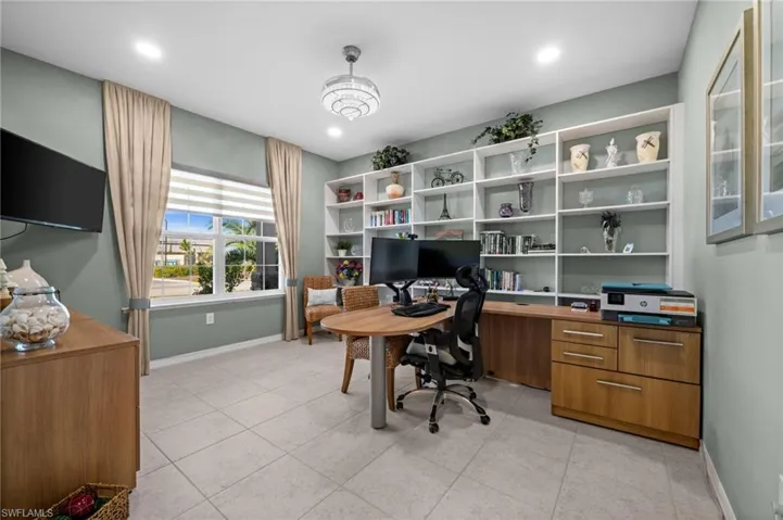 Floor-to-ceiling built-in shelving in office