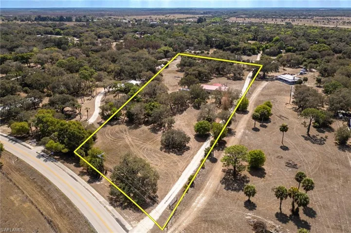 Aerial view of property and surrounding area with property boundaries highlighted