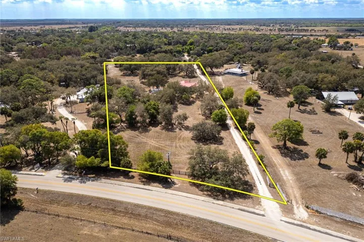 Aerial view of property and surrounding area with property boundaries highlighted