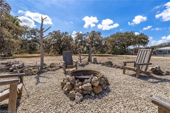 View of yard with a fire pit