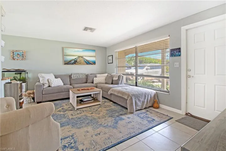 Living room featuring light tile patterned floors
