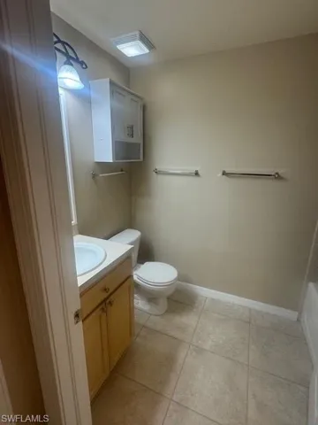 Bathroom with vanity and light tile patterned floors
