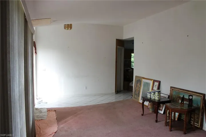 Entry with light tile patterned flooring