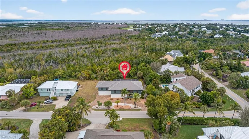 Aerial perspective of suburban area with a forest