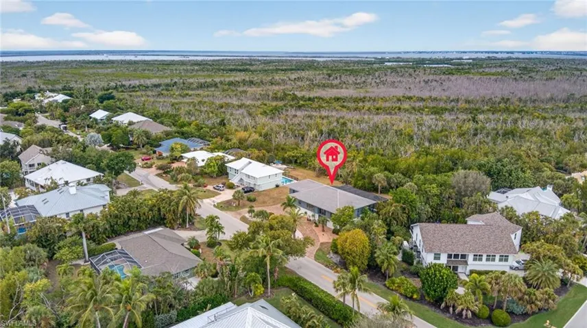 Aerial view of residential area with a forest
