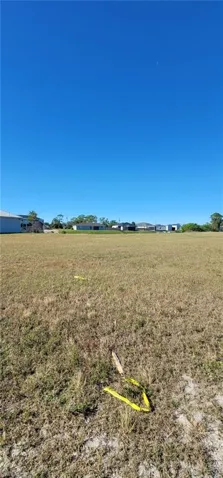 View of grassy yard with a rural view