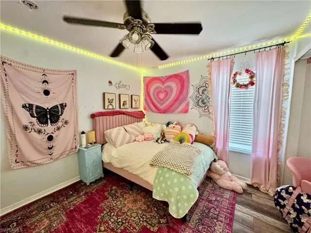 Bedroom featuring a ceiling fan and wood finished floors