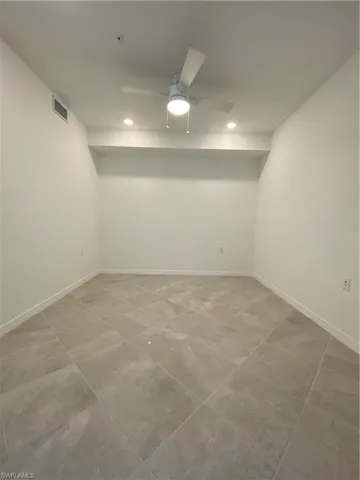 Unfurnished room featuring ceiling fan