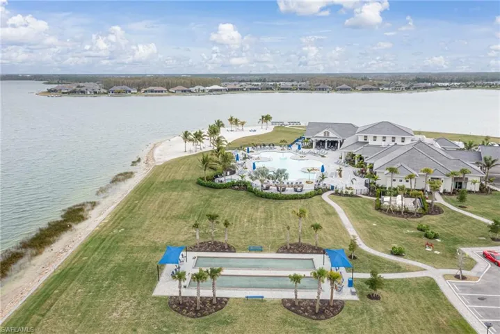 Birds eye view of property featuring bocce courts and a lake view
