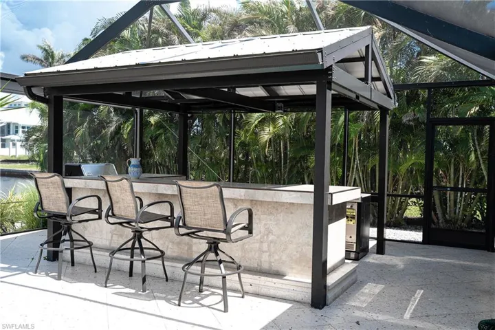 View of patio / terrace with exterior kitchen and a lanai