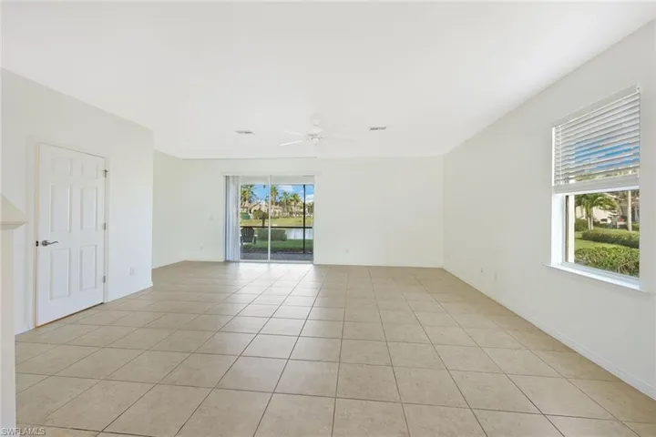 Spare room featuring light tile patterned floors and ceiling fan