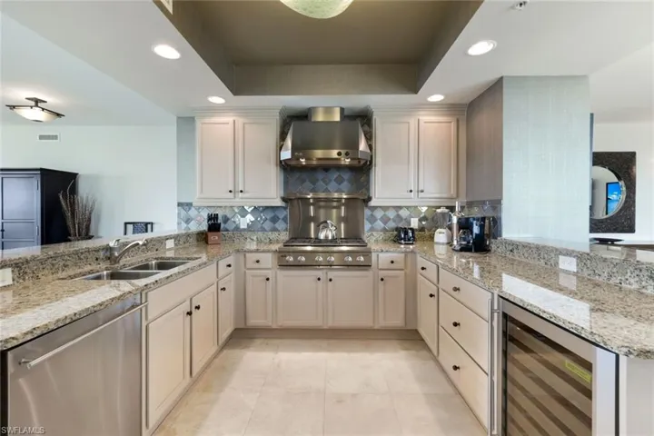 Kitchen featuring Gas Stove, Wine Cooler, Wall Oven, Subzero-style Fridge