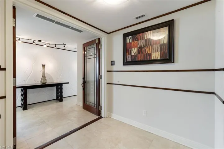 Welcoming Double Door Foyer Entrance from Private Elevator