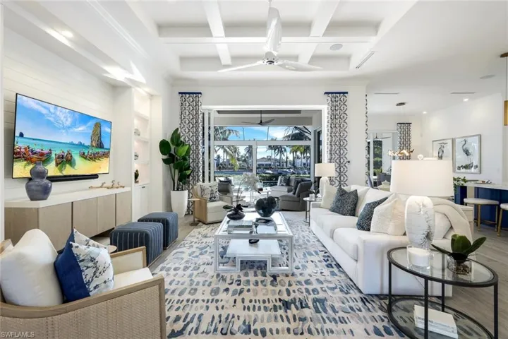 Not a detail missed! Coffered ceiling and gorgeous pool and water views!