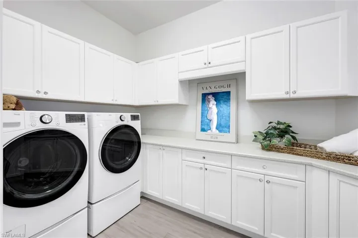 Lovely spacious utility room, with sink, great storage and counter space and windows for great light1