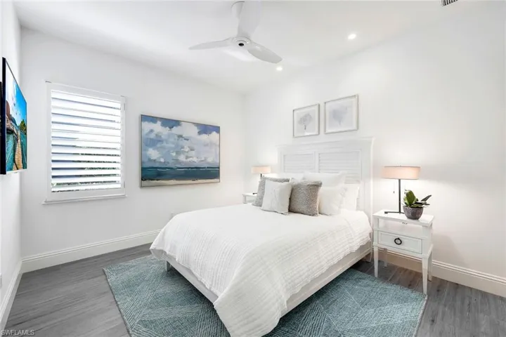 Guest Bedroom 1- Spacious with walk-in closet and beautiful natural light, ceiling fan, and plantation shutter!