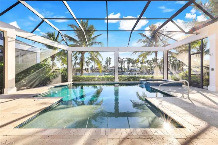 Your backyard oasis complete with SALTWATER pool, spa , gas fireplace, and outdoor summer kitchen!