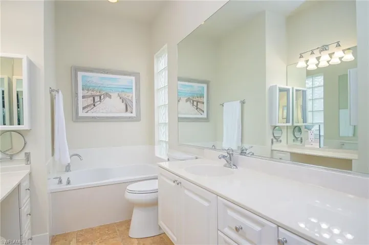 Bathroom featuring, a bathtub, toilet, and vanity