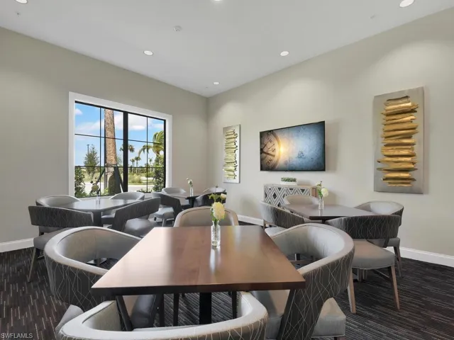 Dining area with dark hardwood / wood-style floors