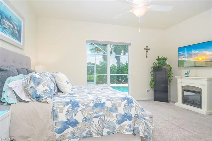 Carpeted bedroom with ceiling fan