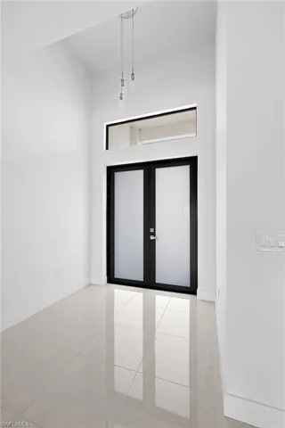 Spare room with light tile floors