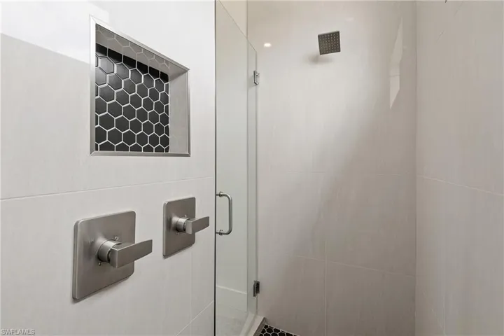 Bathroom featuring a shower with shower door