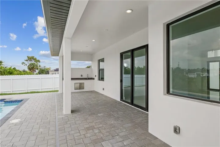 View of patio with a fenced in pool