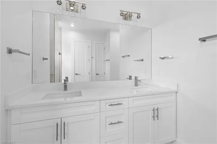 Bathroom featuring dual vanity