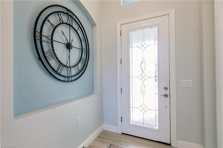 BEAUTIFUL ENTRYWAY. THIS HOME HAS IMPACT RESISTANT WINDOWS & DOORS.